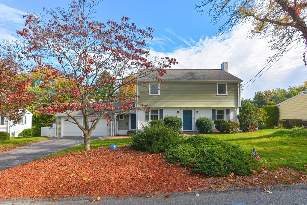 346 Highland Street Dedham, MA 02026 - Photo 1 of 42 a front view of a house with a garden