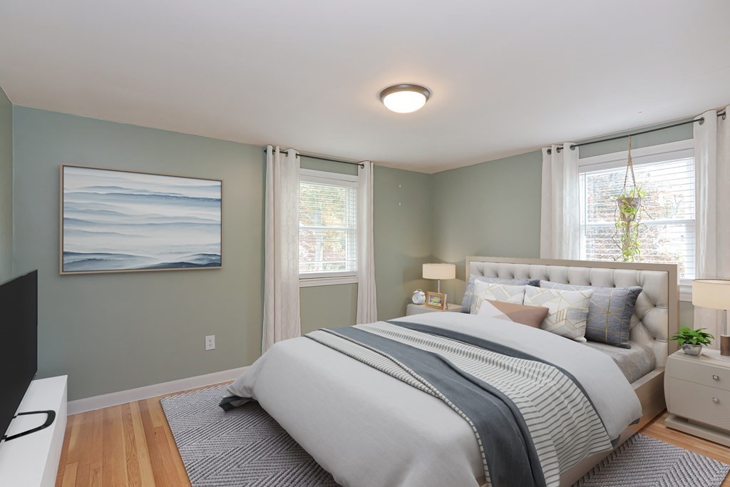 346 Highland Street Dedham, MA 02026 - Photo 20 of 42 a bedroom with a bed and a window