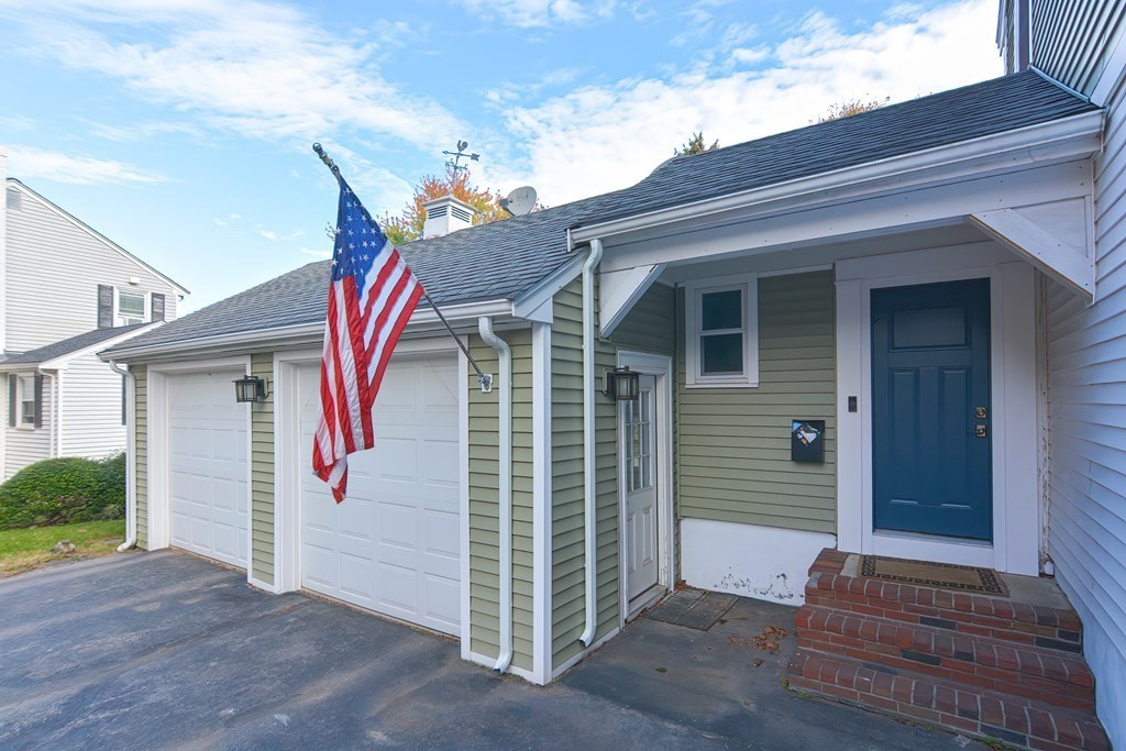 346 Highland Street Dedham, MA 02026 - Photo 2 of 42 a view of a house with a potted plant and stairs