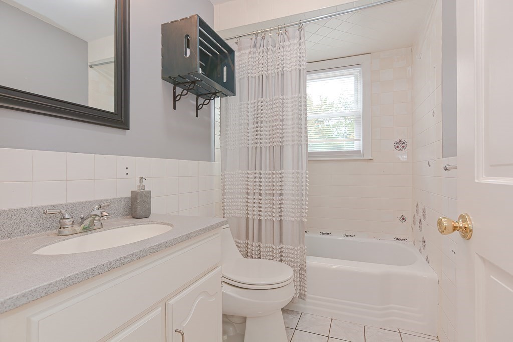 346 Highland Street Dedham, MA 02026 - Photo 26 of 42 a bathroom with a sink toilet and shower