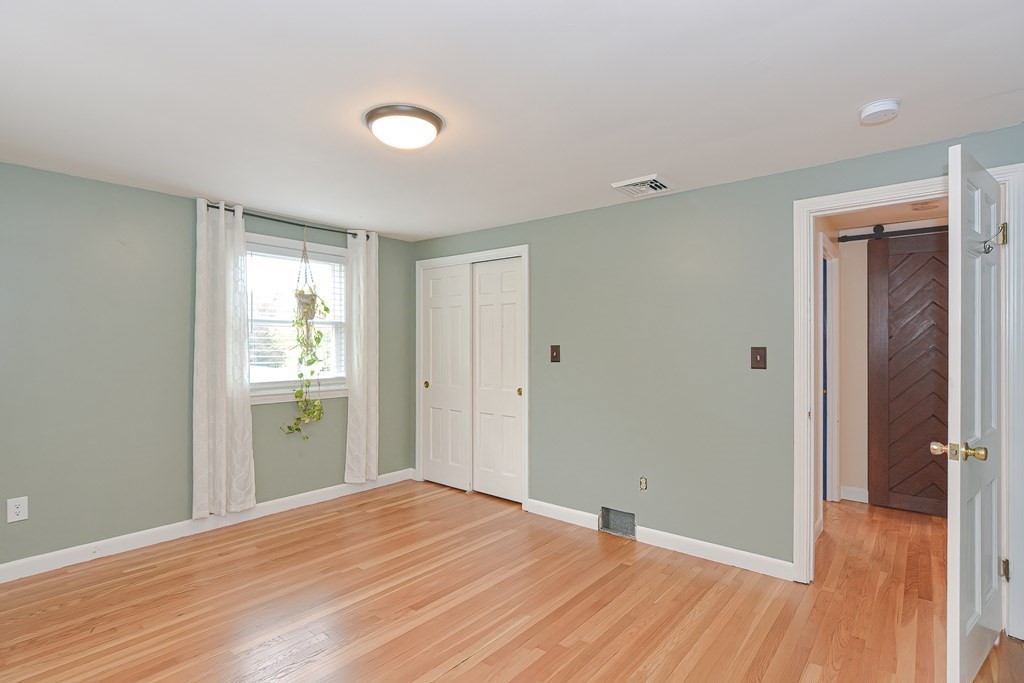 346 Highland Street Dedham, MA 02026 - Photo 33 of 42 a view of a room with wooden floor and bathroom
