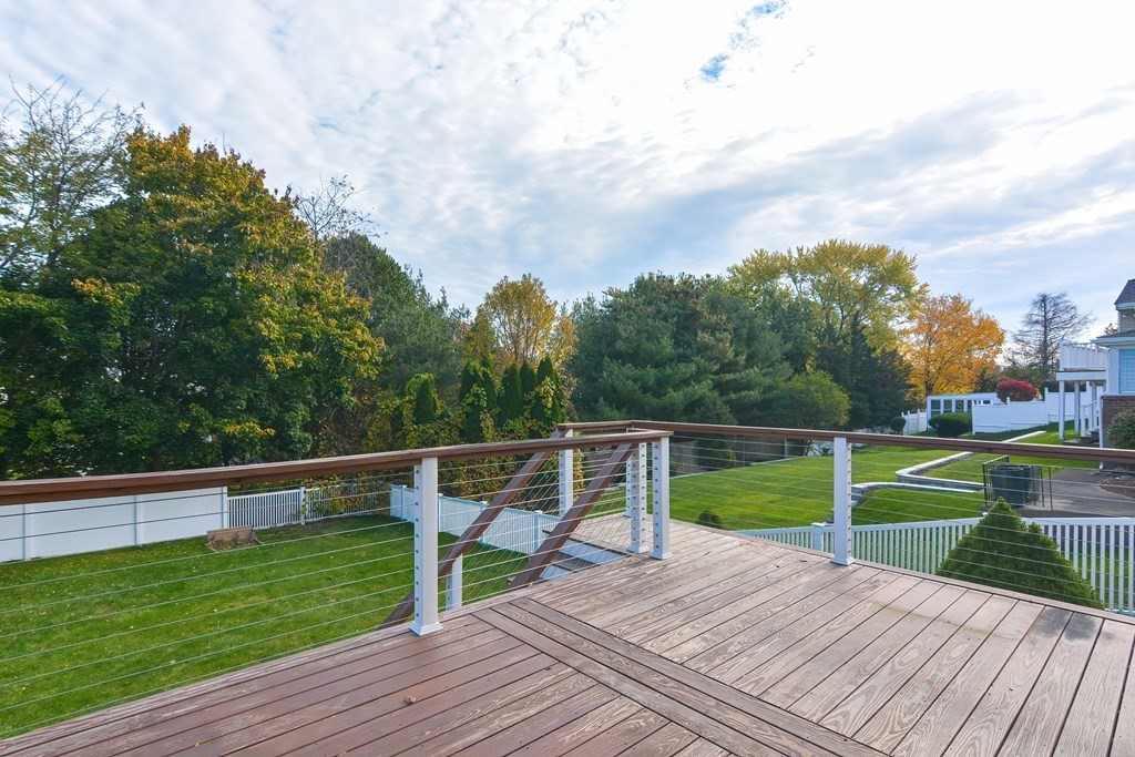 346 Highland Street Dedham, MA 02026 - Photo 37 of 42 a view of deck with seating and green space