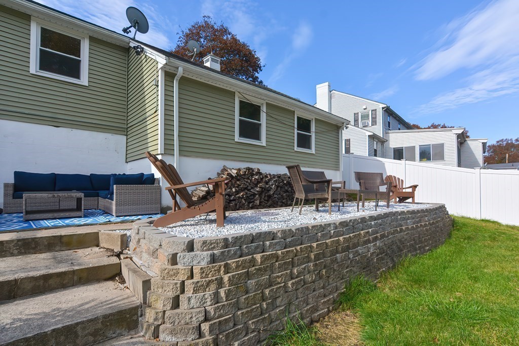 346 Highland Street Dedham, MA 02026 - Photo 38 of 42 a view of a house with backyard and sitting area