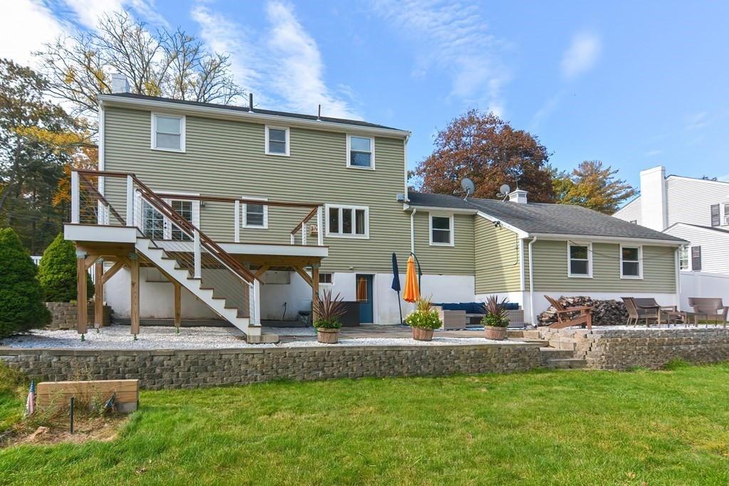 346 Highland Street Dedham, MA 02026 - Photo 42 of 42 a front view of a house with a yard