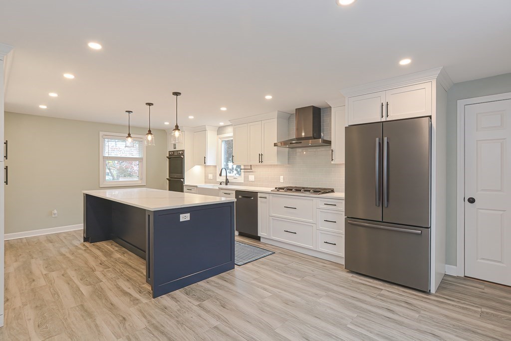 346 Highland Street Dedham, MA 02026 - Photo 7 of 42 a kitchen with stainless steel appliances granite countertop a refrigerator and a sink