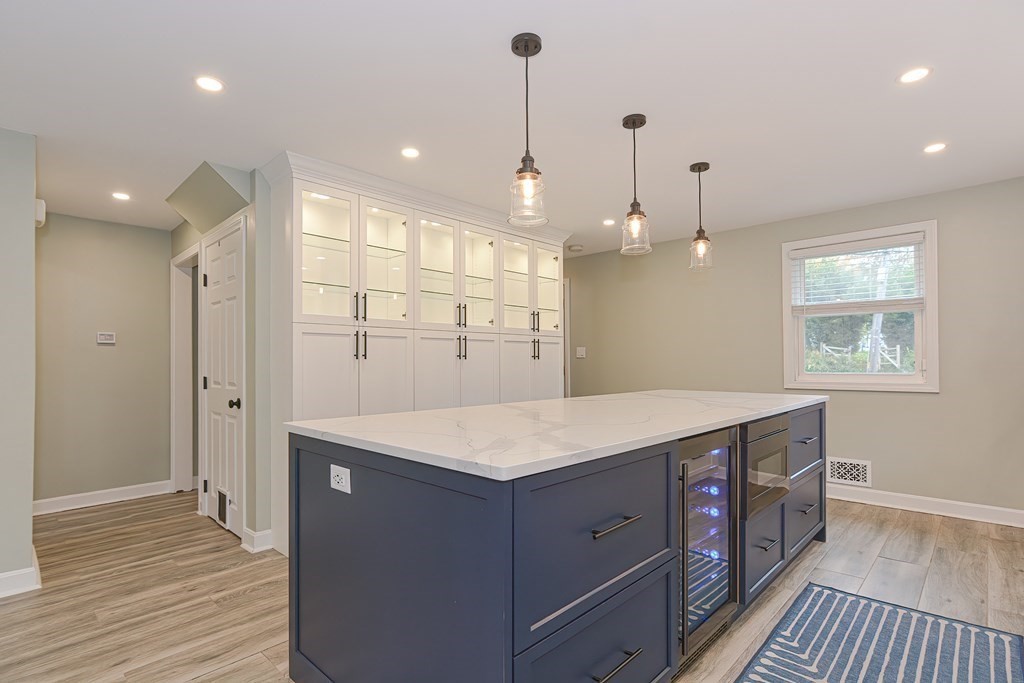 346 Highland Street Dedham, MA 02026 - Photo 8 of 42 a kitchen that has a lot of cabinets in it with wooden floor