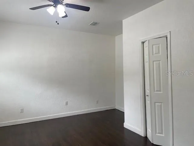 an empty room with a view of a livingroom