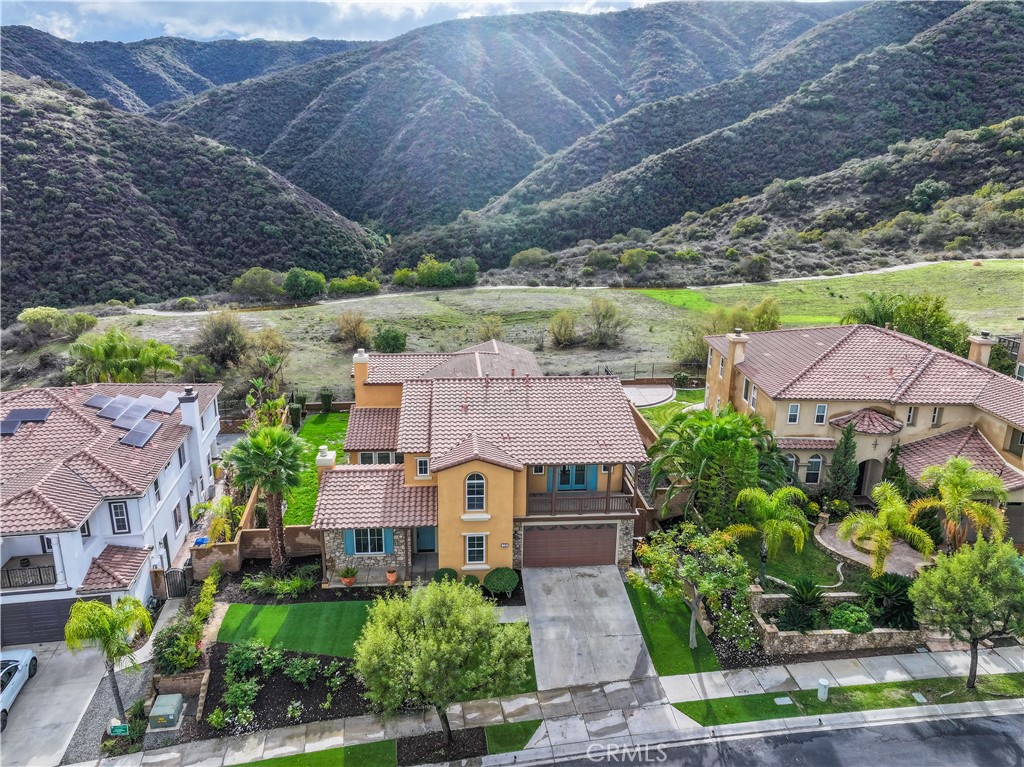 an aerial view of a house with a garden