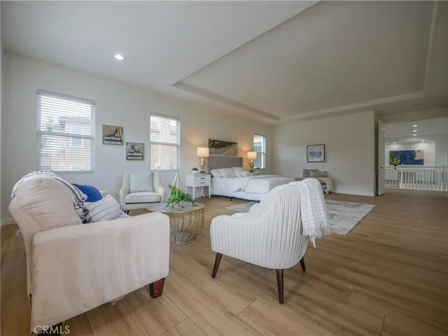 a living room with furniture or couch and a wooden floor