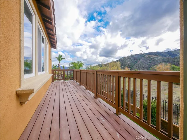 a view of balcony with wooden floor