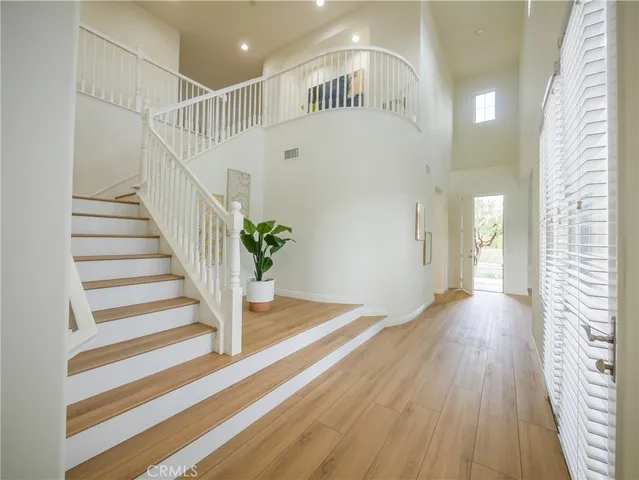 a view of entryway with wooden floor