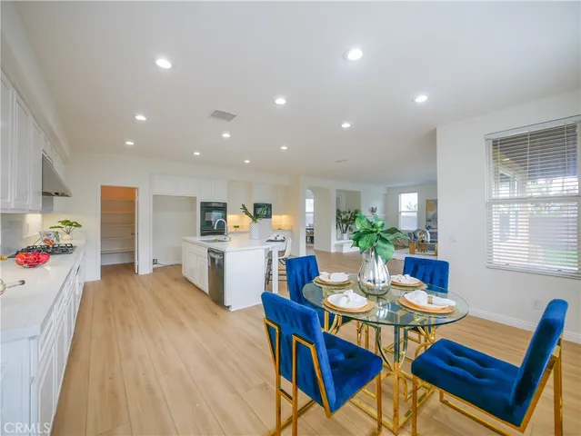 a view of a dining room with furniture and window