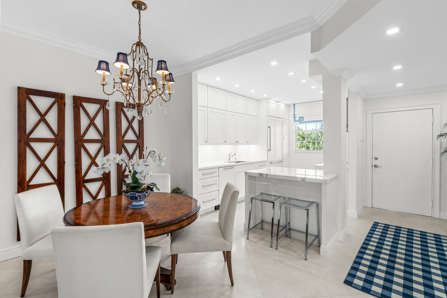 127 Peruvian Avenue, Unit 302 Palm Beach, FL 33480 - Photo 15 of 43 a view of a dining room with furniture and chandelier
