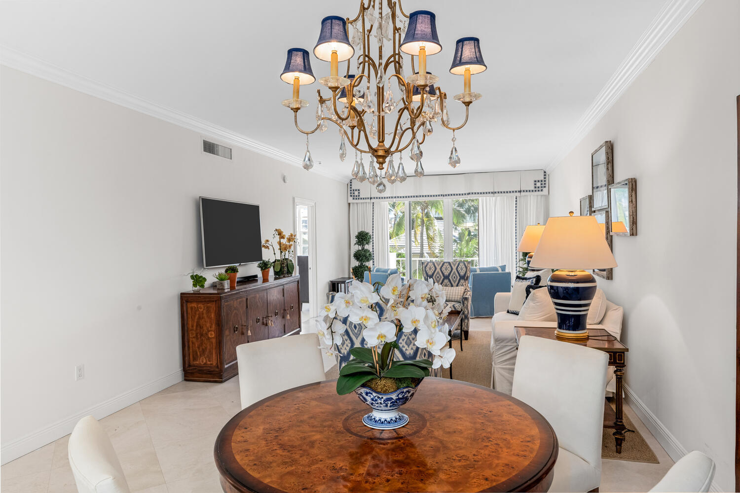 127 Peruvian Avenue, Unit 302 Palm Beach, FL 33480 - Photo 19 of 43 a dining room with furniture a chandelier and window