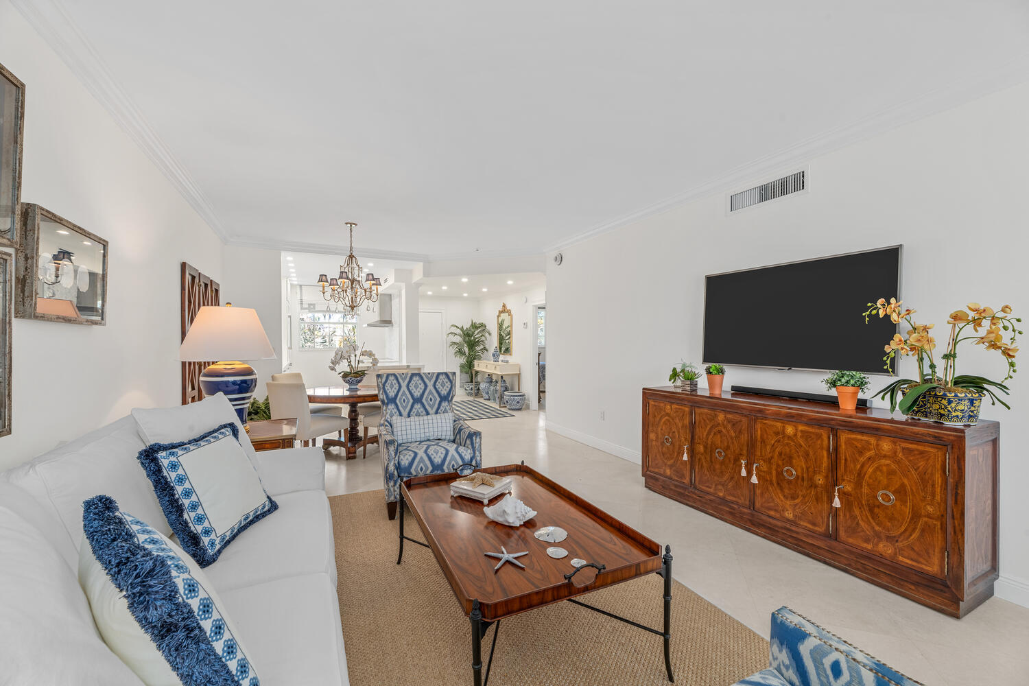 127 Peruvian Avenue, Unit 302 Palm Beach, FL 33480 - Photo 29 of 43 a living room with furniture and a flat screen tv