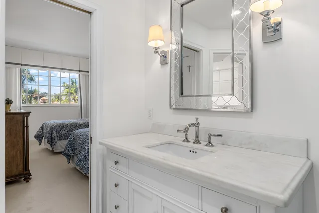 a en suite bathroom with a sink and mirror