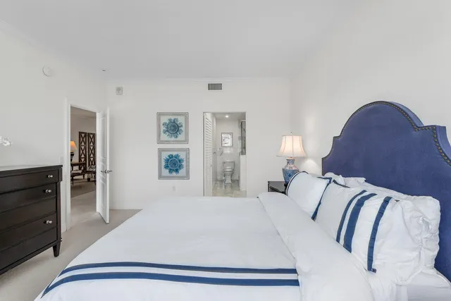 a bedroom with a bed and dresser