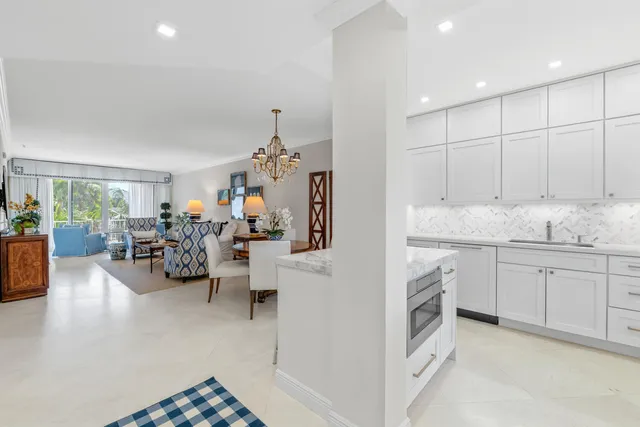 a view of a living room kitchen and a window