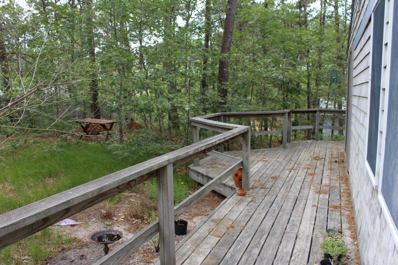 37 Bartlett Road Wellfleet, MA 02667 - Photo 11 of 14 a view of balcony with wooden floor and fence
