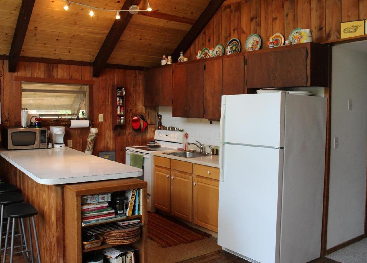 37 Bartlett Road Wellfleet, MA 02667 - Photo 3 of 14 a kitchen with stainless steel appliances a refrigerator and a stove