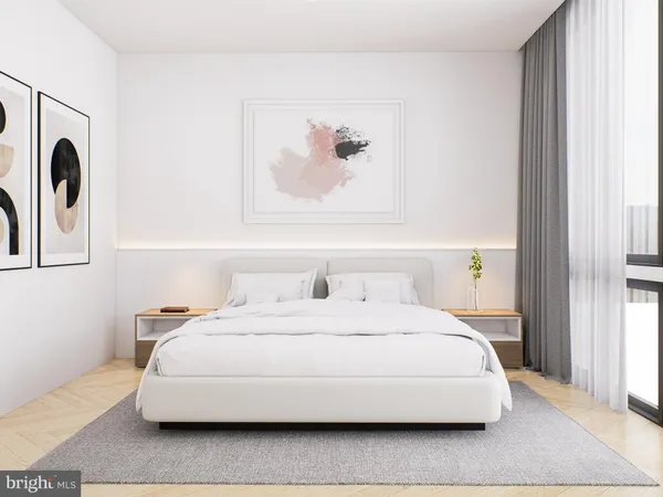 a bedroom with a bed and a painting on the wall