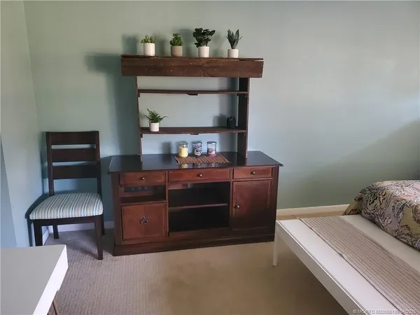 a room with a table and a fireplace