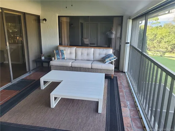 a living room with a couch and a table