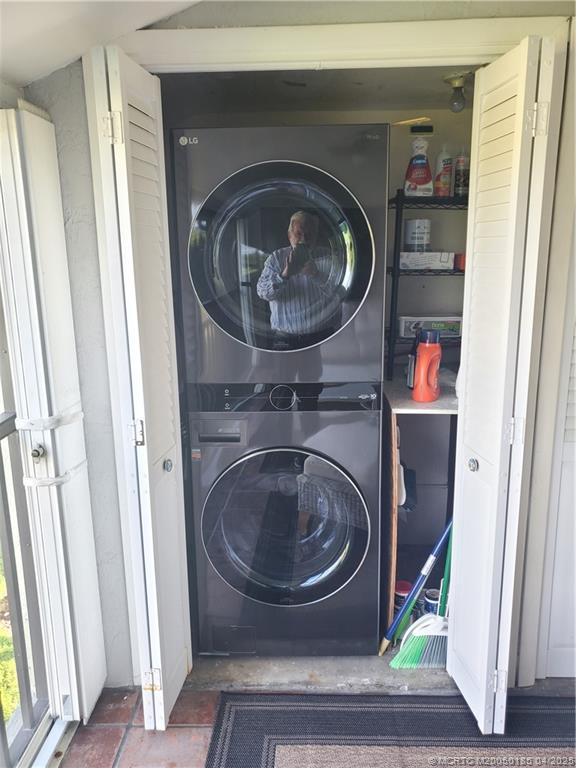 1411 Northeast 14th Court, Unit 13 Jensen Beach, FL 34957 - Photo 20 of 20 a room with a washer and dryer