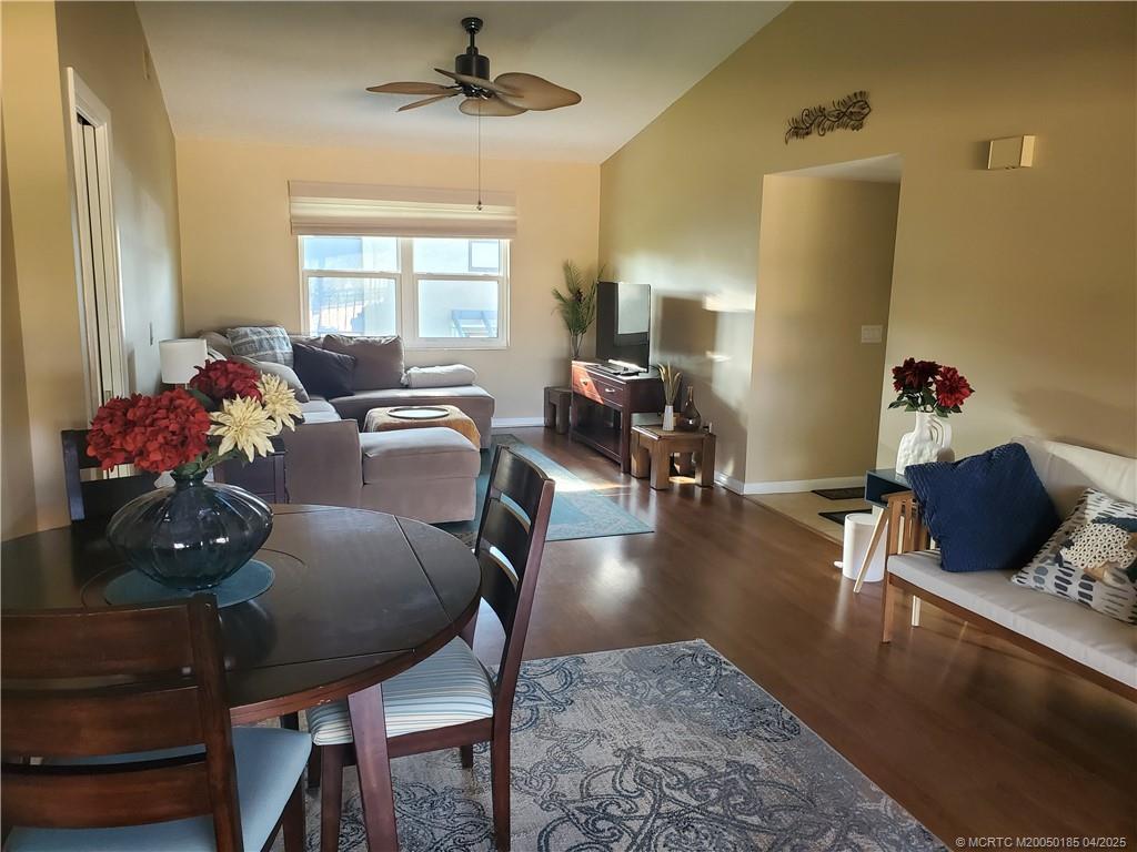 1411 Northeast 14th Court, Unit 13 Jensen Beach, FL 34957 - Photo 2 of 20 a living room with furniture and a window