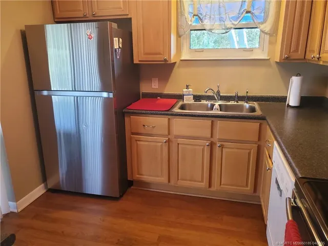 a kitchen with appliances and cabinets