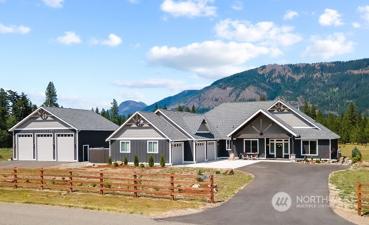 1450 Old Cedars Road Cle Elum, WA 98922 - Photo 1 of 40 a front view of a house with a yard