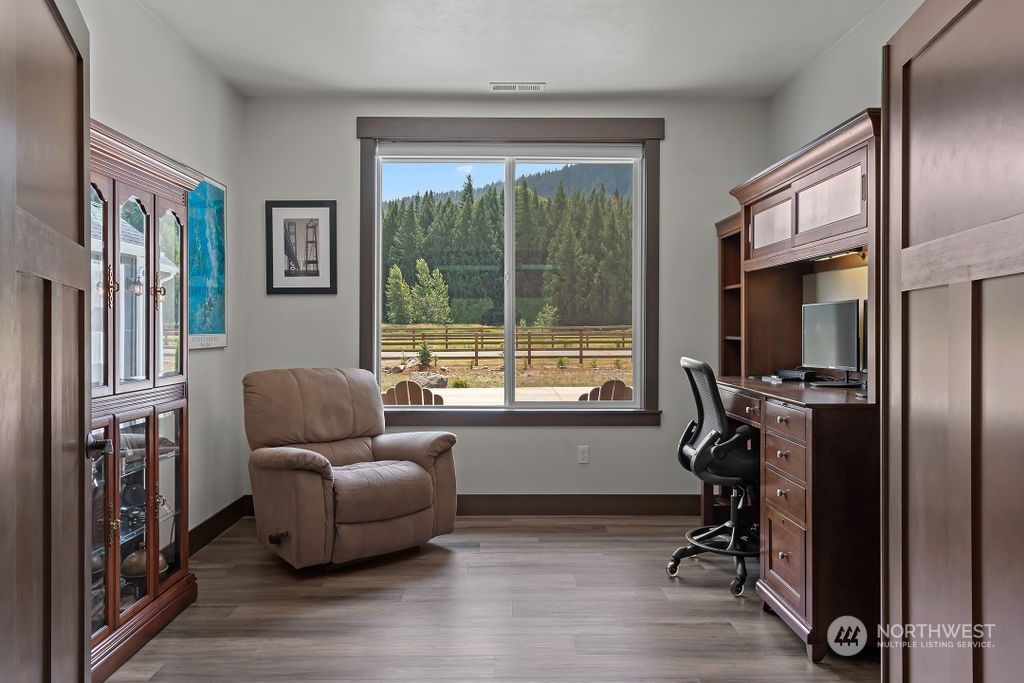 1450 Old Cedars Road Cle Elum, WA 98922 - Photo 23 of 40 a living room with furniture and a flat screen tv