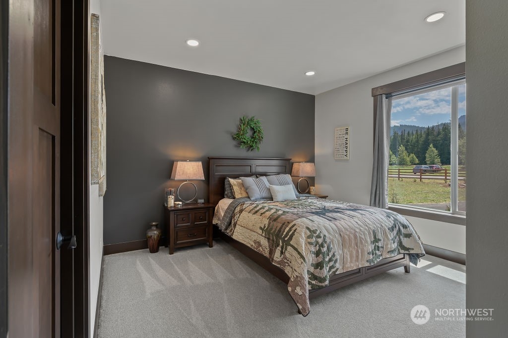 1450 Old Cedars Road Cle Elum, WA 98922 - Photo 24 of 40 a bedroom with a bed and a window
