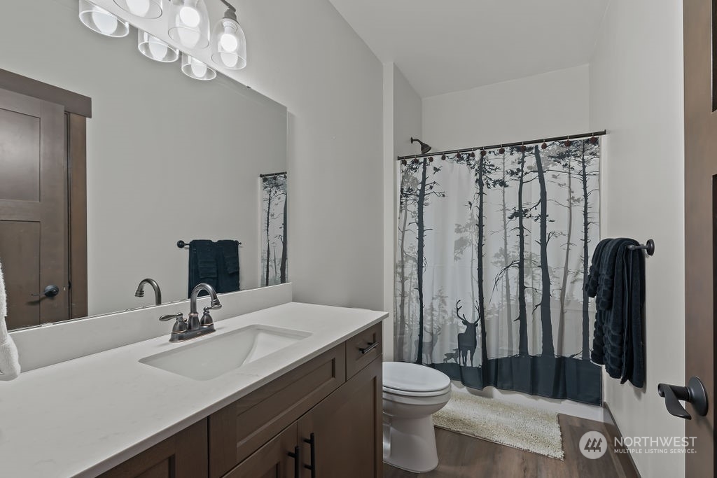 1450 Old Cedars Road Cle Elum, WA 98922 - Photo 25 of 40 a bathroom with a sink a toilet and shower