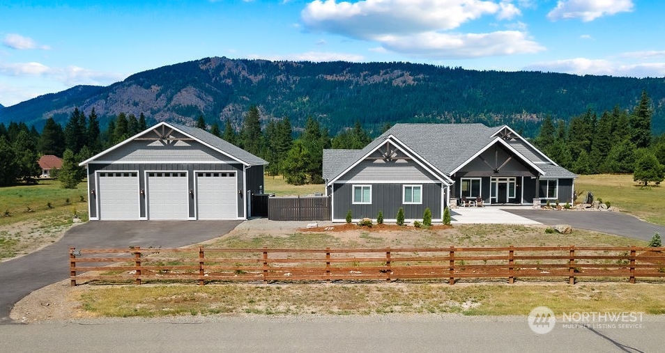 1450 Old Cedars Road Cle Elum, WA 98922 - Photo 40 of 40 a front view of a house with a yard