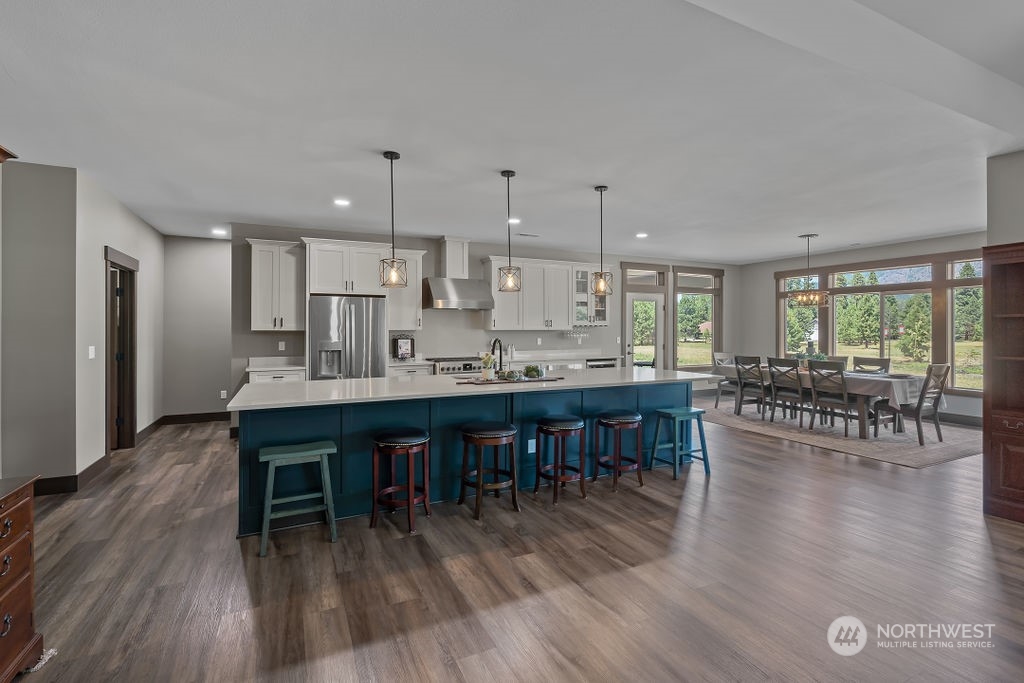 1450 Old Cedars Road Cle Elum, WA 98922 - Photo 9 of 40 a large kitchen with a table and chairs