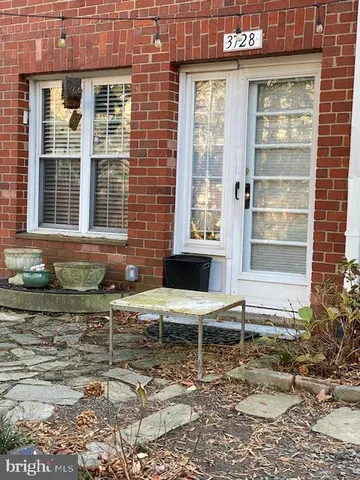 a couple of chairs in front of house