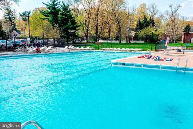 a childrens park with lots of swings and slides