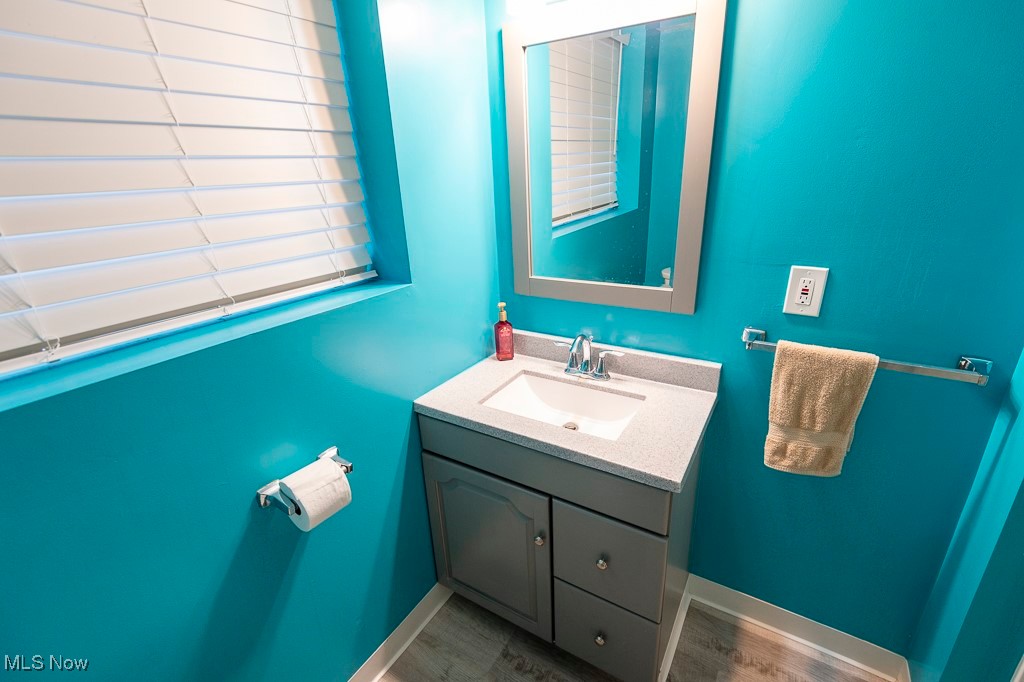 11819 Sheldon Road Mantua, OH 44255 - Photo 31 of 46 Lower level Bathroom featuring vanity and luxury vinyl plank flooring