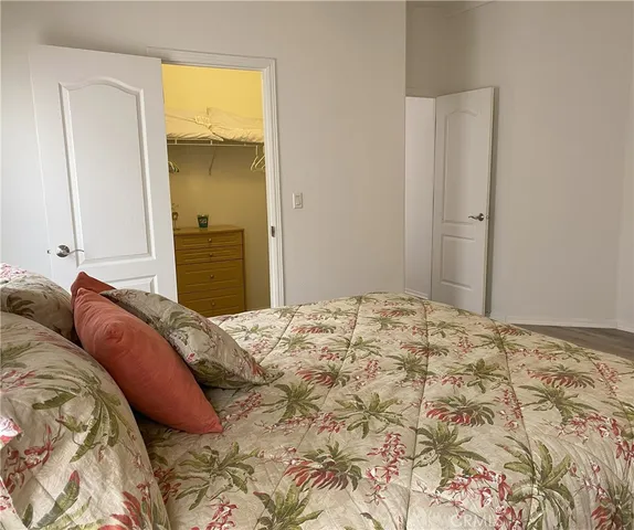 a bedroom with a bed and hallway