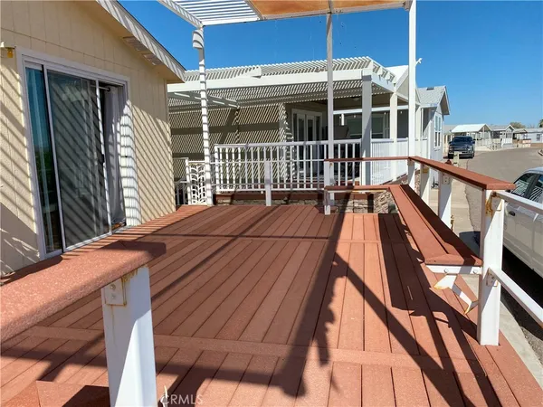 a view of balcony with wooden floor