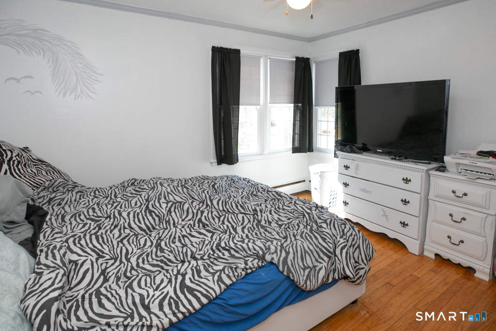 10 Beach Park Road Clinton, CT 06413 - Photo 20 of 39 A second bedroom with hardwood floors completes the first floor living area . . .