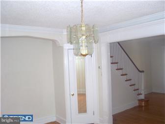 328 Kingston Road Upper Darby, PA 19082 - Photo 6 of 12 a view of a water heater room with a hallway