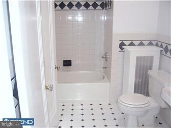 328 Kingston Road Upper Darby, PA 19082 - Photo 9 of 12 a bathroom with a toilet and a shower