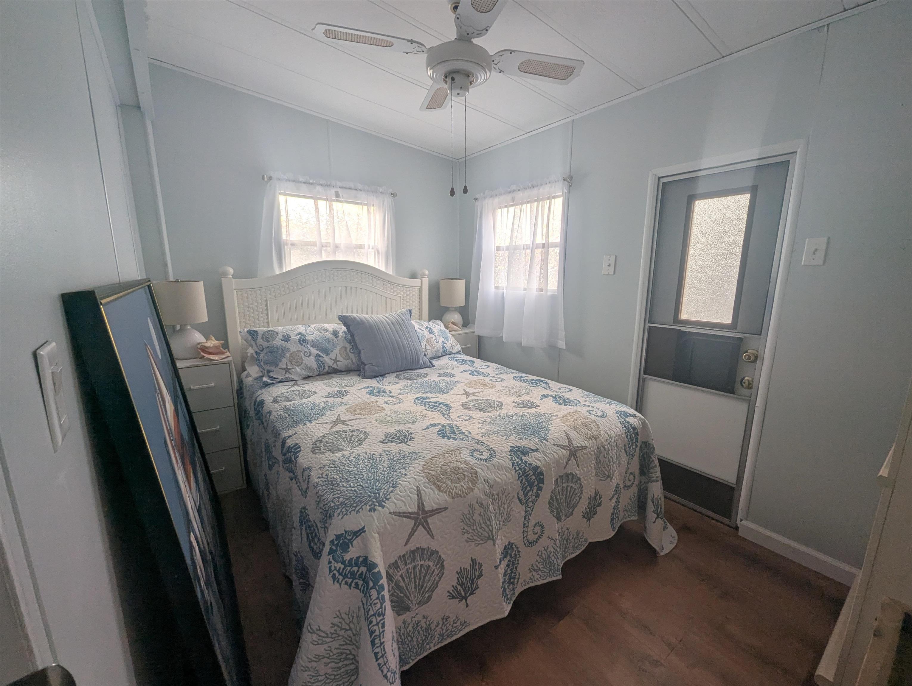 209 Horseshoe, Unit 209 Ocean View, NJ 08246 - Photo 15 of 19 a bedroom with a bed and window
