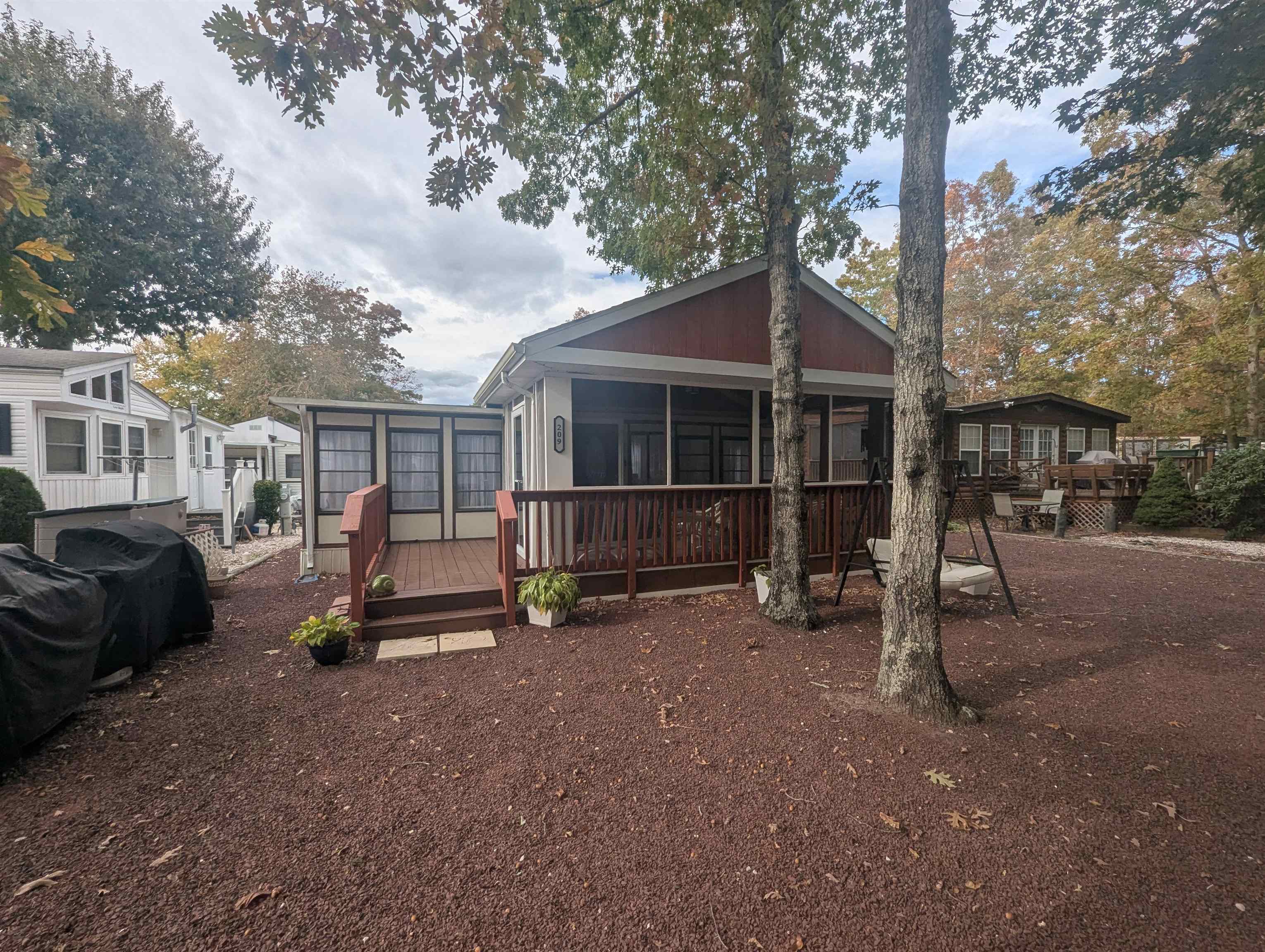 209 Horseshoe, Unit 209 Ocean View, NJ 08246 - Photo 17 of 19 a view of a house with backyard and a tree