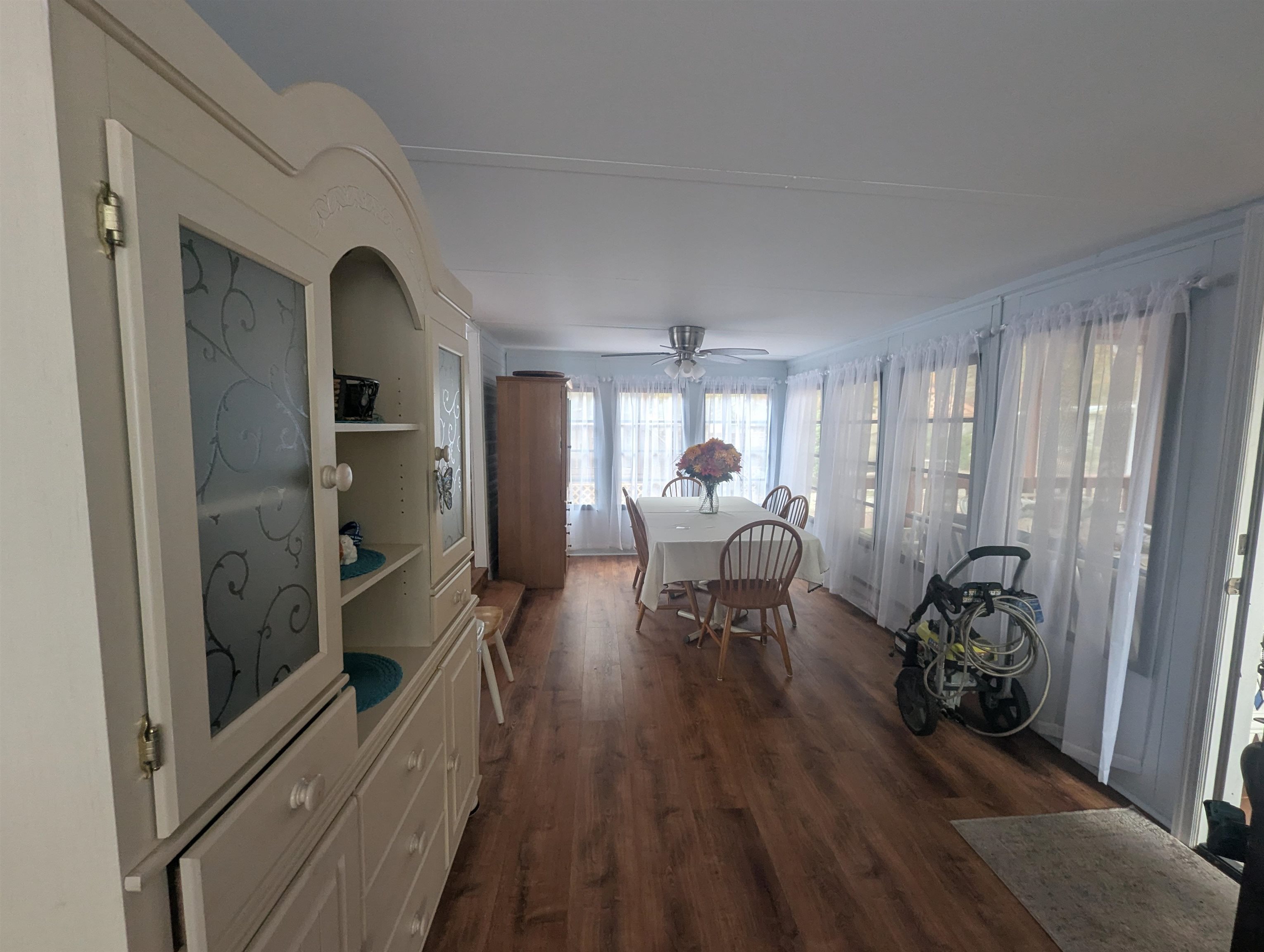 209 Horseshoe, Unit 209 Ocean View, NJ 08246 - Photo 4 of 19 a living room with furniture and a wooden floor