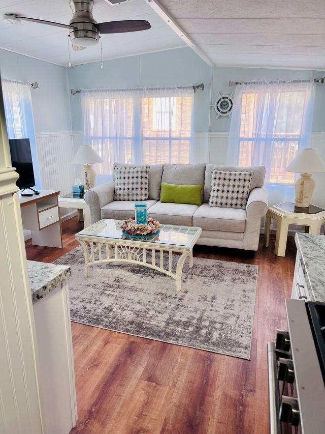 209 Horseshoe, Unit 209 Ocean View, NJ 08246 - Photo 10 of 19 a living room with furniture and a flat screen tv