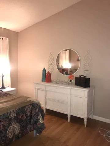 a bathroom with double vanity sink and a mirror