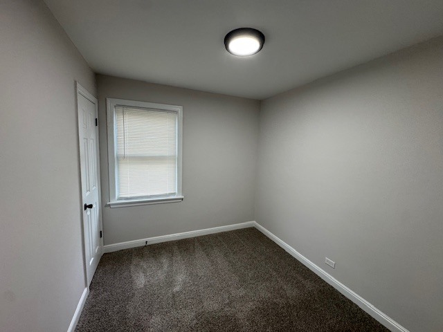 10454 South Forest Avenue Chicago, IL 60628 - Photo 11 of 16 an empty room with a window